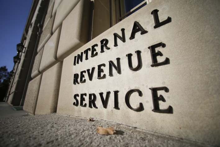 The Internal Revenue Service (IRS) building stands in Washington, D.C., U.S., on Tuesday, Nov. 13, 2012. President Barack Obama expressed confidence that he and Congress would reach an agreement that will avoid the automatic spending cuts and tax increases that are scheduled to occur at the end of the year. The fiscal cliff is the $607 billion combination of automatic spending cuts and tax increases scheduled to take effect in January. Lawmakers are trying to avert the cliff to prevent a short-term shock to the economy and reach an agreement on long-term deficit reduction. Photographer: Andrew Harrer/Bloomberg